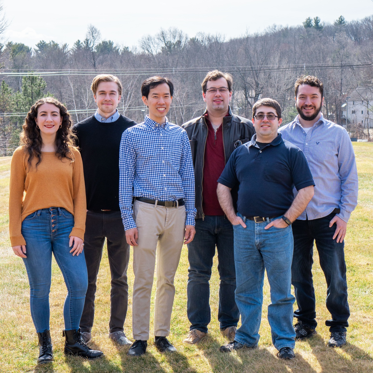  6 Andplus team leaders standing shoulder to shoulder outside