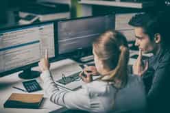 Two software developers discussing code